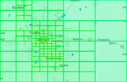 Image represents a geographical map, likely of the Denver, Colorado area, overlaid with a grid of large, bright green rectangular cells.  The cells form a coarse-grained partition of the map, covering a wide region encompassing cities such as Boulder, Arvada, Denver, Aurora, Centennial, Parker, Watkins, Strasburg, and Byers.  Major highways (indicated by numbers like 70, 25, 270, etc.) and smaller roads are visible within the cells, along with bodies of water depicted in light blue.  City names are labeled, providing geographical context. The grid's purpose appears to be a spatial partitioning scheme, possibly for data sharding, load balancing, or geographic data organization in a system design context.  The size and arrangement of the cells suggest a deliberate, possibly hierarchical, division of the area, with a finer-grained grid apparent in the Denver/Aurora area, indicating potentially higher data density or processing needs in that region.