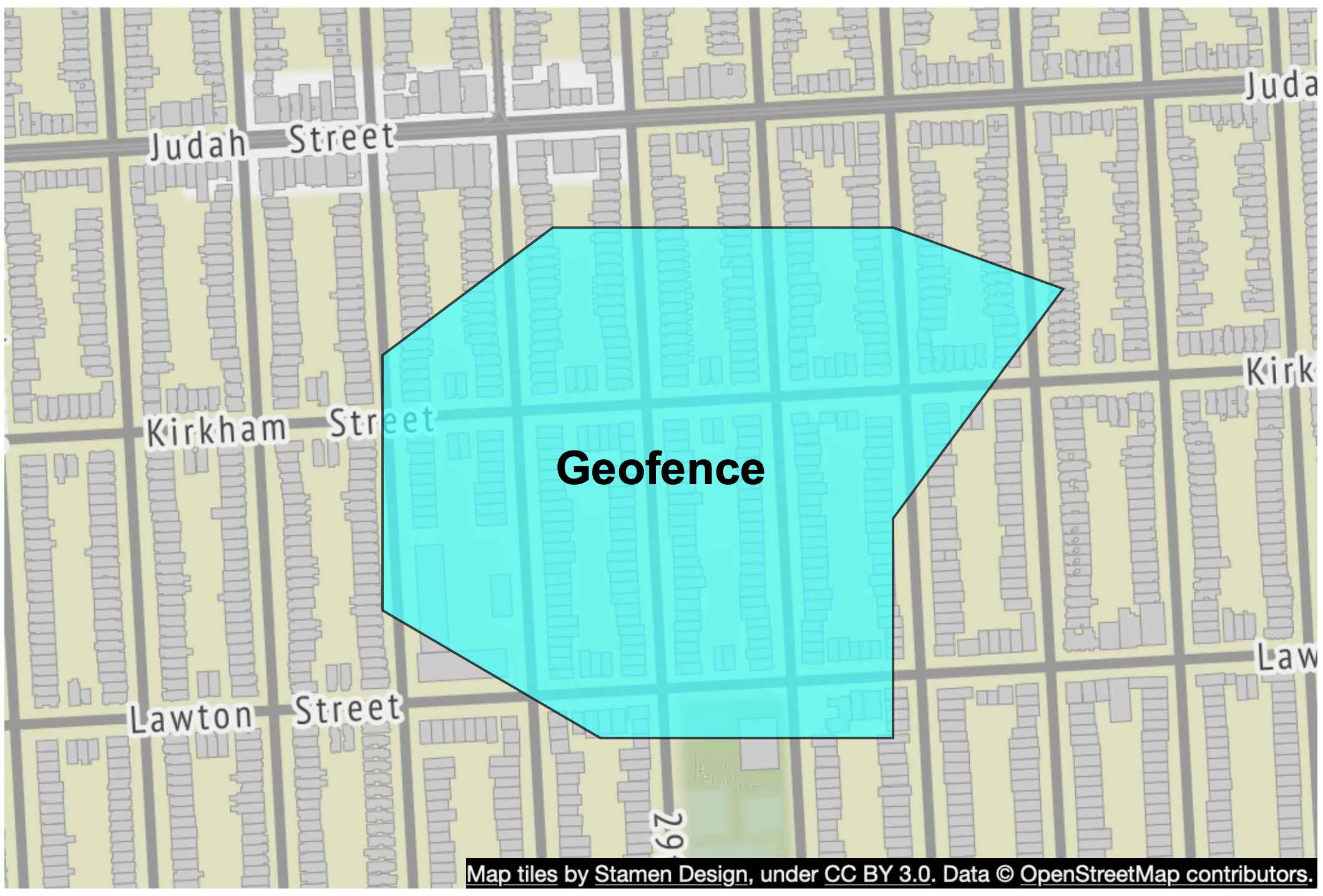 Image represents a map depicting a geofence overlaid on a street map.  The base map shows a section of a city with streets labeled 'Judah Street,' 'Kirkham Street,' 'Lawton Street,' and parts of 'Juda' and 'Law' streets visible.  Buildings are represented as light gray rectangles arranged in city blocks.  A light teal polygon, labeled 'Geofence,' is superimposed on the map, irregularly shaped and encompassing several city blocks.  The geofence's boundary does not precisely follow street lines but rather cuts across blocks, indicating a custom-defined area.  The bottom of the image includes an attribution statement: 'Map tiles by Stamen Design, under CC BY 3.0. Data © OpenStreetMap contributors,' indicating the source of the map data.  The number '29' is partially visible near the bottom of the geofence, possibly indicating a street number or other location identifier within the geofenced area.